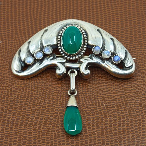Bernhard Hertz; An Art Nouveau silver brooch with chrysoprase and moonstone Bernhard Hertz; An Art Nouveau silver brooch with chrysoprase and moonstone